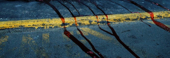 Blood running on pavement.