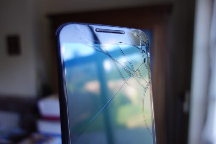 A smartphone with a broken screen.